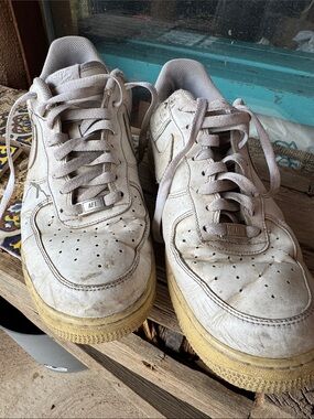 Nike White Leather Low-Top Sneakers with Yellowed Soles